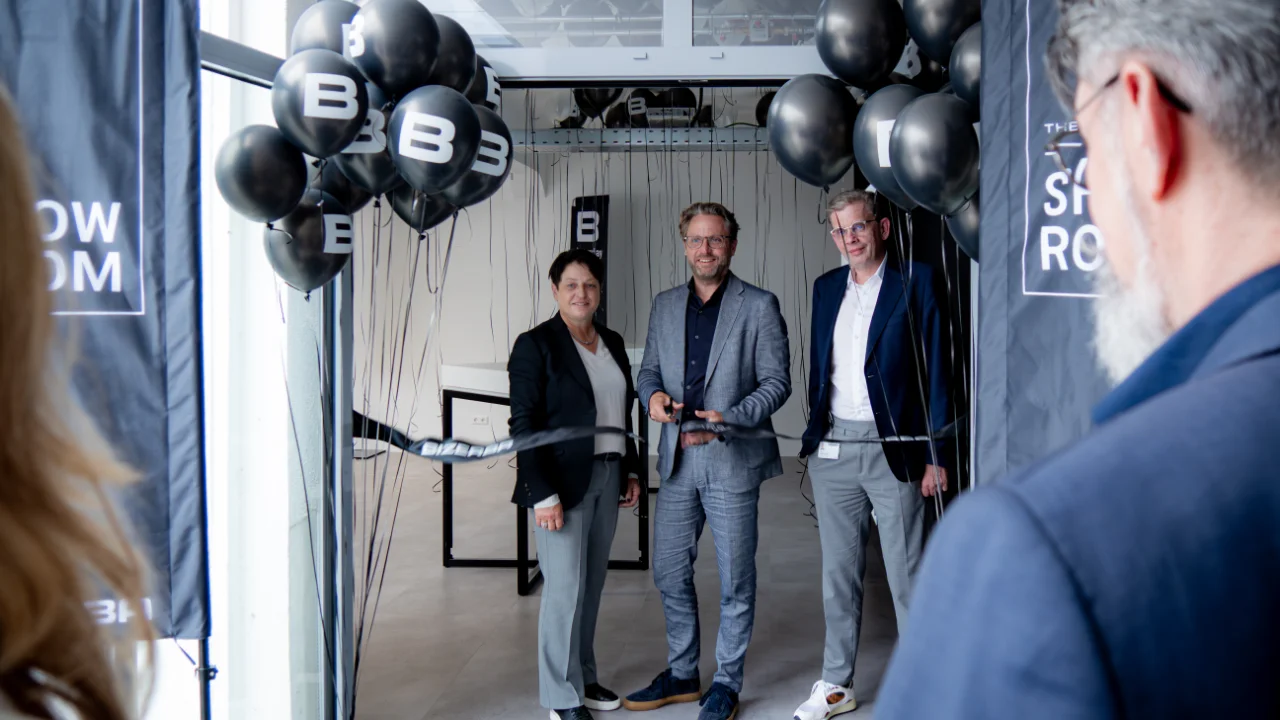 Angela Kraut, CFO and Shareholder (left), Andreas W. Kraut, CEO and Shareholder (center), and COO Peter Riedel (right) officially opened the new BIZERBA showroom with a ceremonial ribbon-cutting on July 1, 2026. (© BIZERBA)